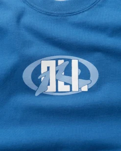 Oli X Badge Tee | Rusty Hot