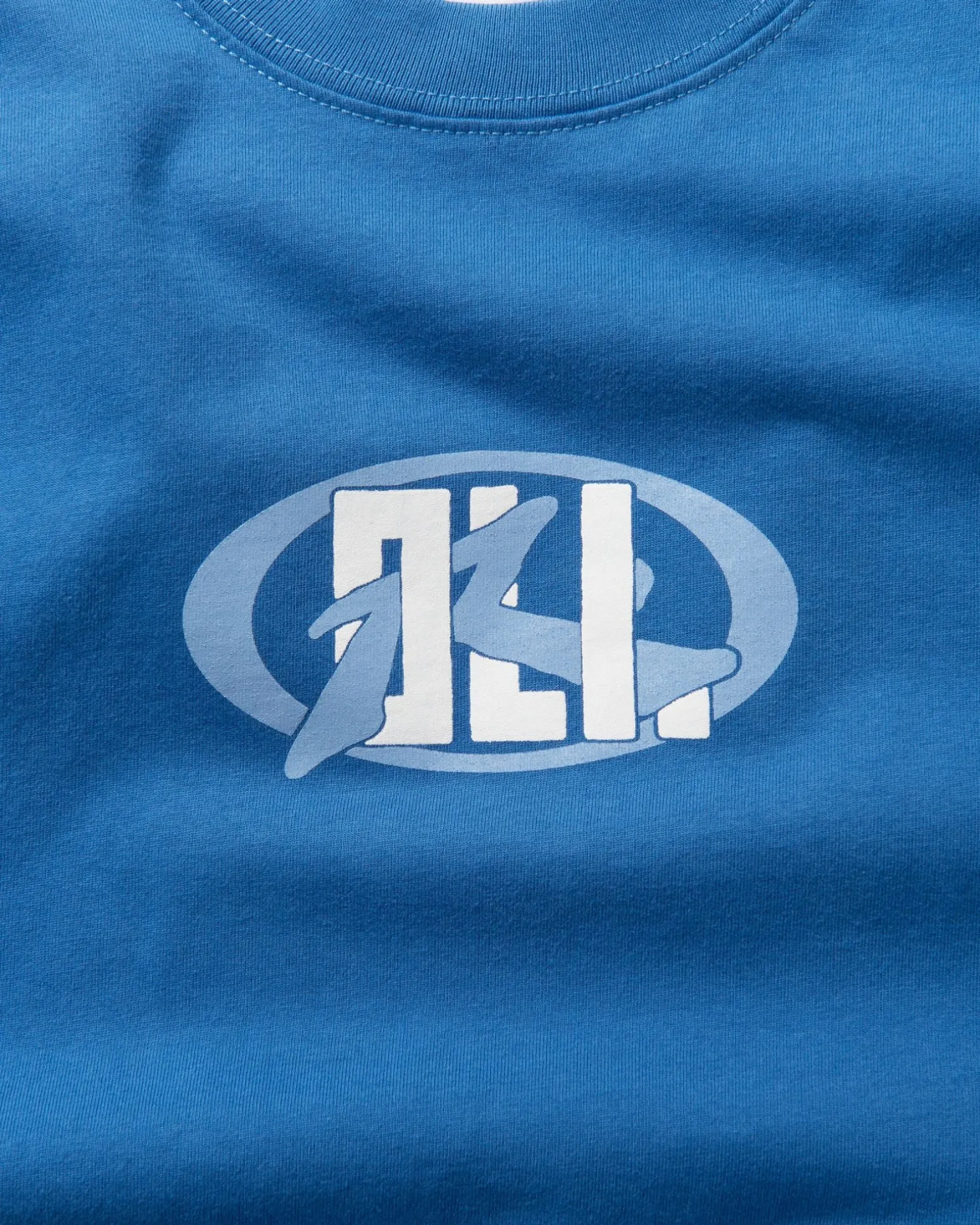 Oli X Badge Tee | Rusty Hot