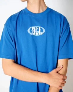 Oli X Badge Tee | Rusty Hot